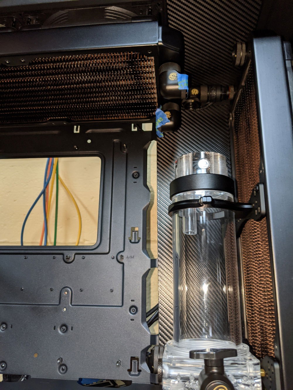 Carbon Vinyl wrapped acrylic panels to hide cables.