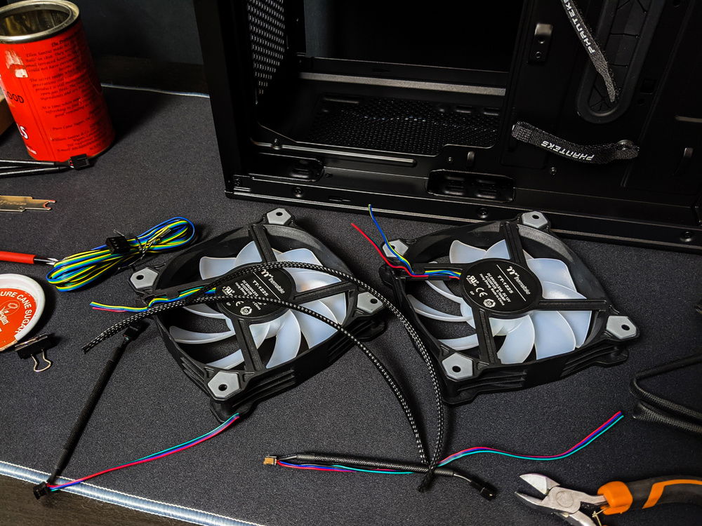 To save the budget we raided the parts bin and found these Thermaltake Pure 12 fans that had the cables removed to make them easier to use for test fittings.
