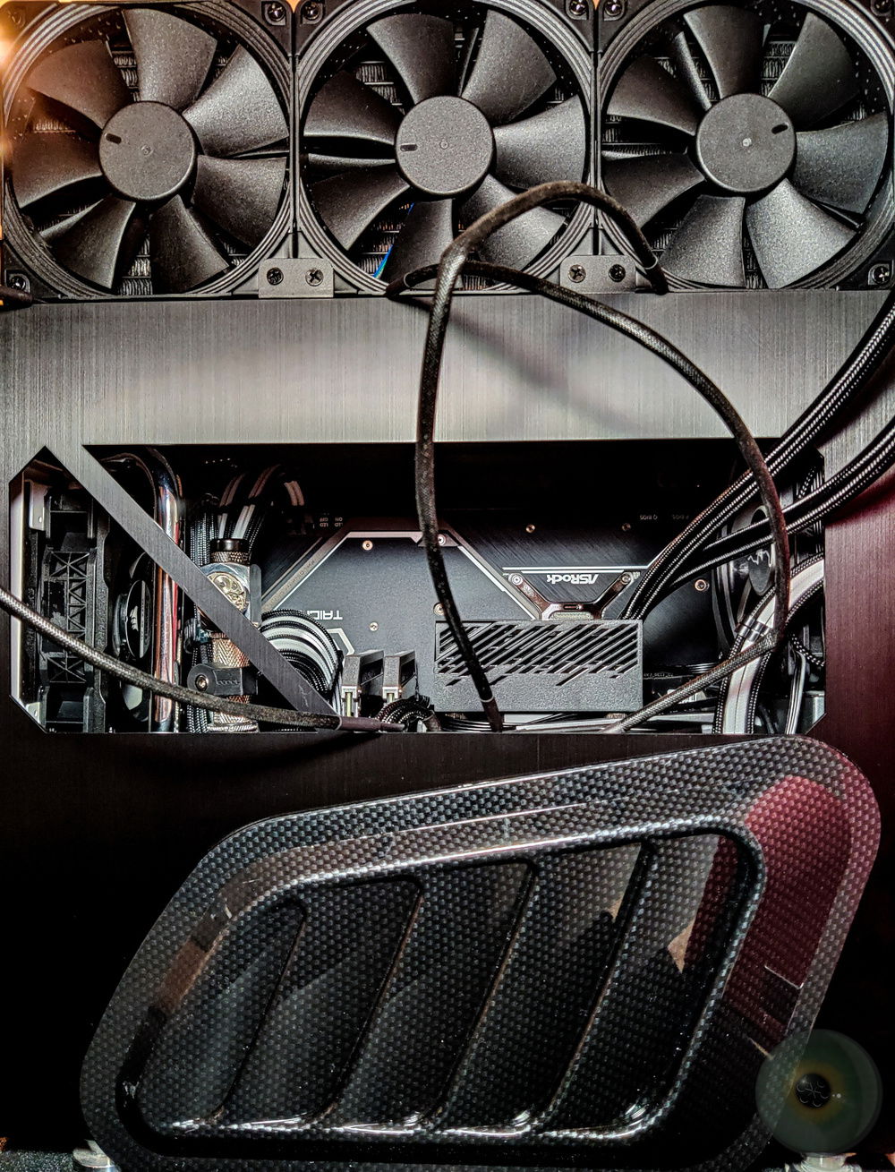 The external radiator in top, heat rises, and the fans above blow colder outdoor air straight into the rad