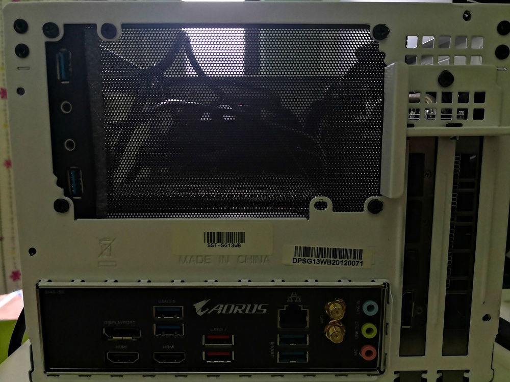 Initial idea on how to address the PSU gap left behind rear of the case. Cut some mesh filter and placed them there, tried to secure it by screwing it on the PSU screw mounting holes.