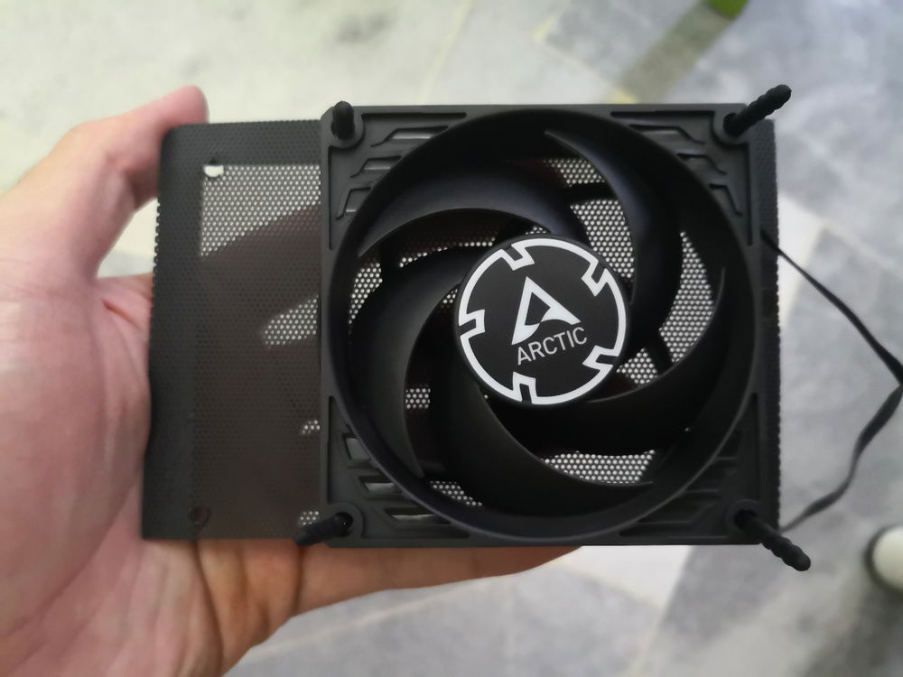 Initial idea was to put an 80mm fan (Arctic P8) at the rear gap left behind by the PSU. This... also didn't end well.