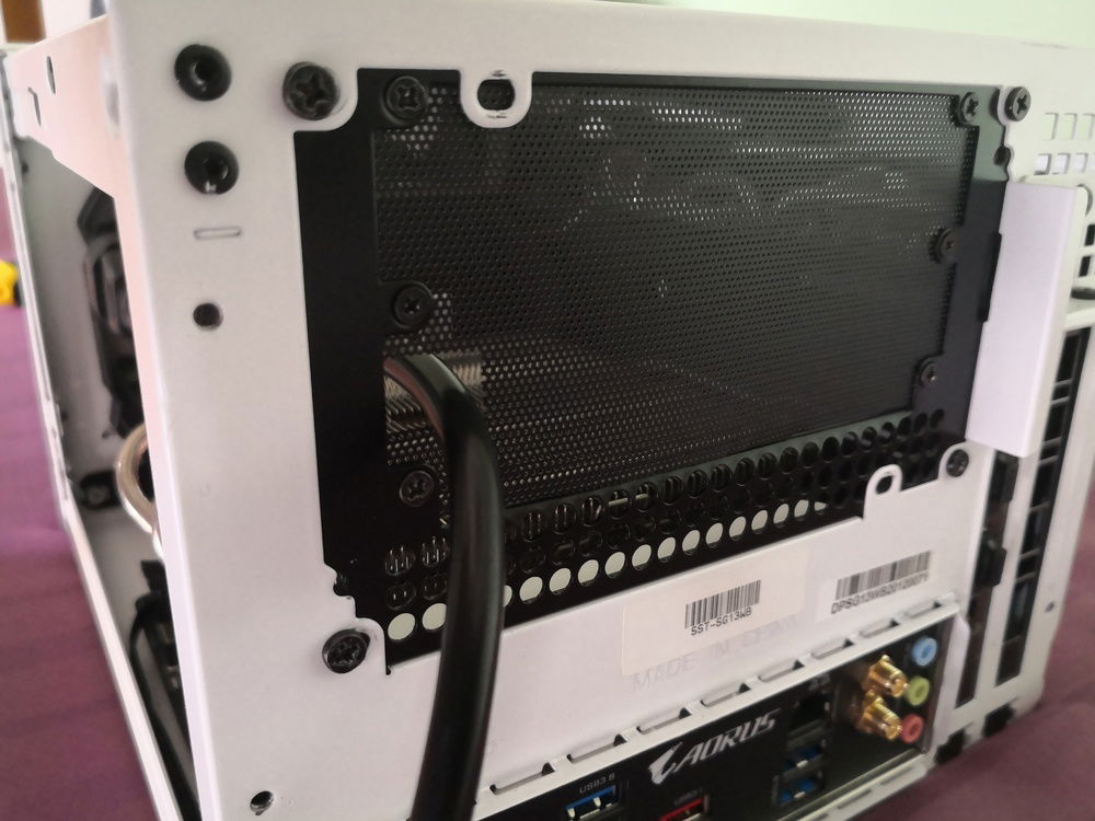 Had to redo the rear filter (previous one was damaged from having the P8 mounted on it). Since the regular ATX PSU gap needed too much filter, I opted to use Silverstone's own ATX-SFX PSU bracket, the PP08, to reduce the gap I needed to cover with mesh. Same as before, the mesh is mounted using screws, and I made a small cut-out for the PSU cable.