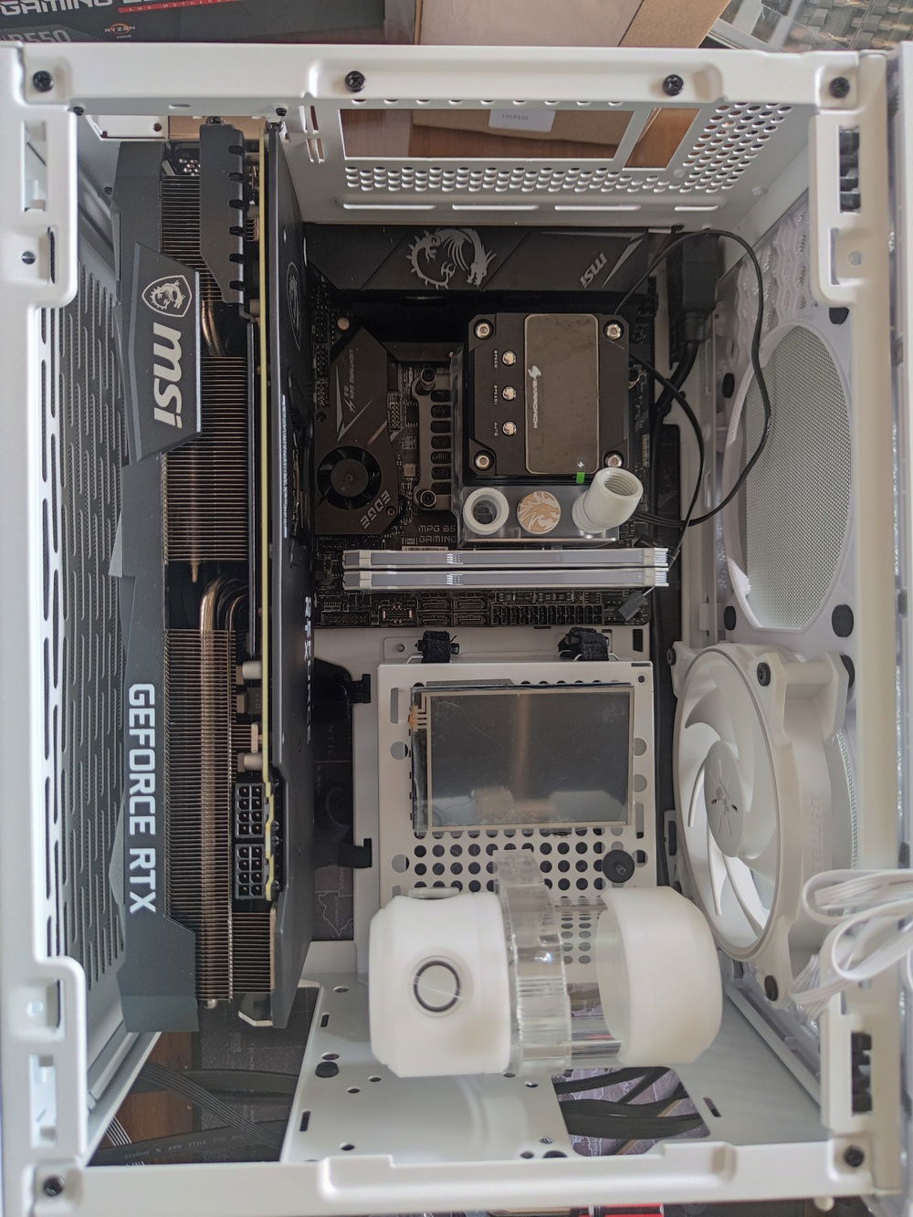 The NR200P supports 2 locations for the SFX power supply, and I was choosing between the two. I ultimately found that the side placement of the PSU cage took up too much space and placed the internal LCD too far away from the glass side panel.