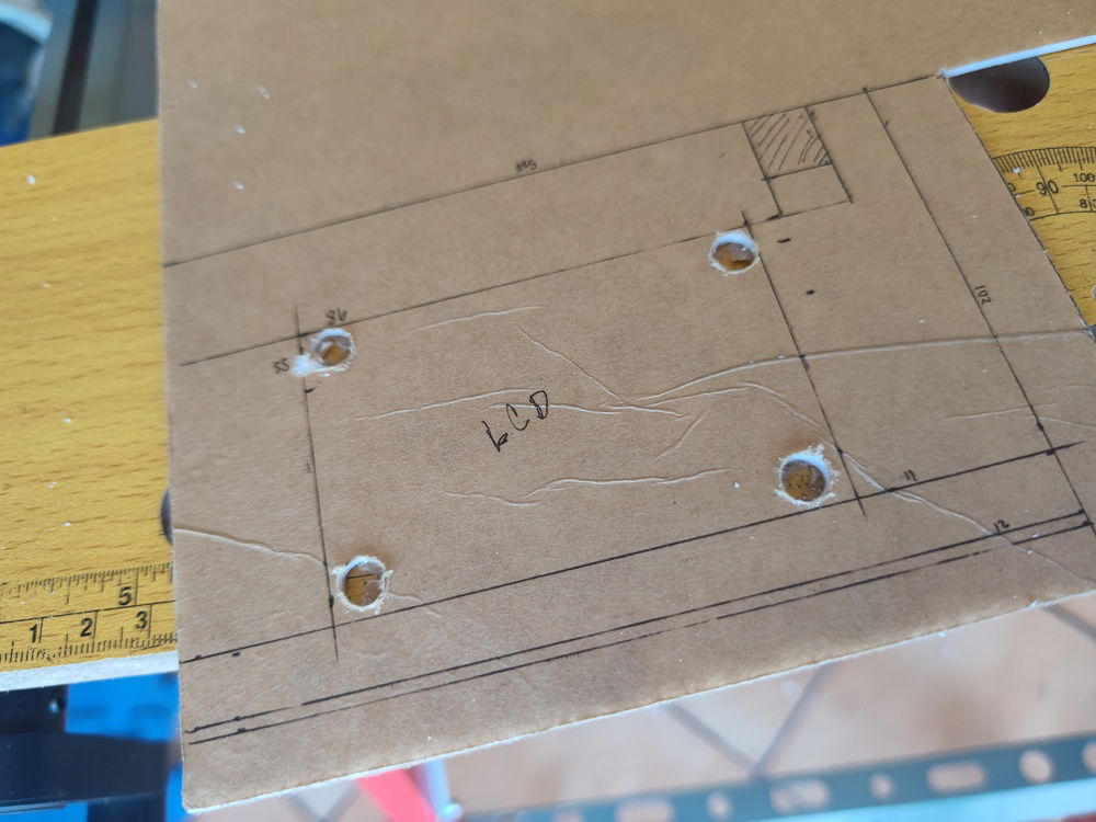 I first drilled into the corners of the acrylic so I could fit the jigsaw blade and cut out the 3.5" hole. I ultimately cracked the side of the frame and had to start over.