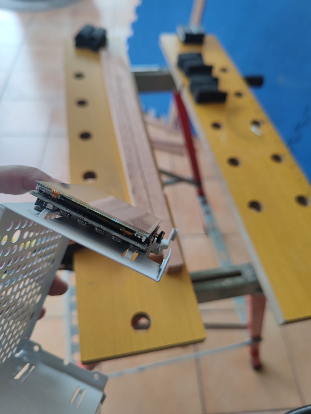 The LCD was mounted using 3M mounting tape and eventually, the frame that surrounds it.