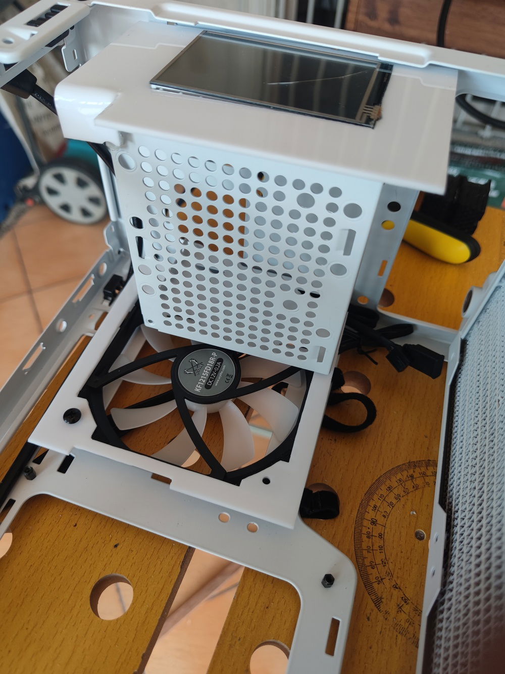 This pic shows that the shroud is not fully level with the LCD; this was fixed later byscrewing in the tab at upper left.