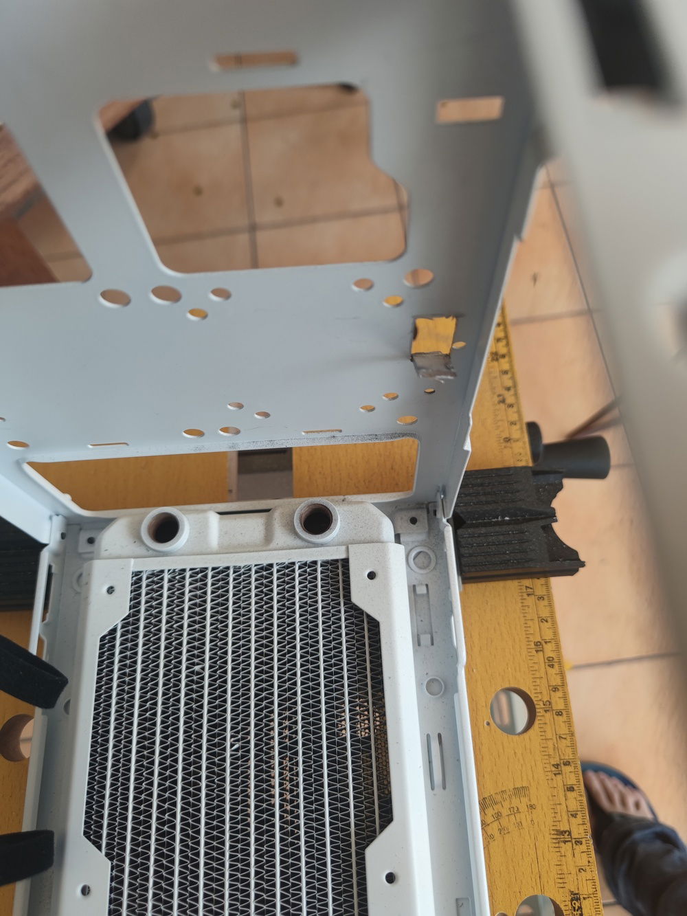 Cooler Master uses some tough steel for its cases. I used a dremel tool to cut open this access port for the HDMI.