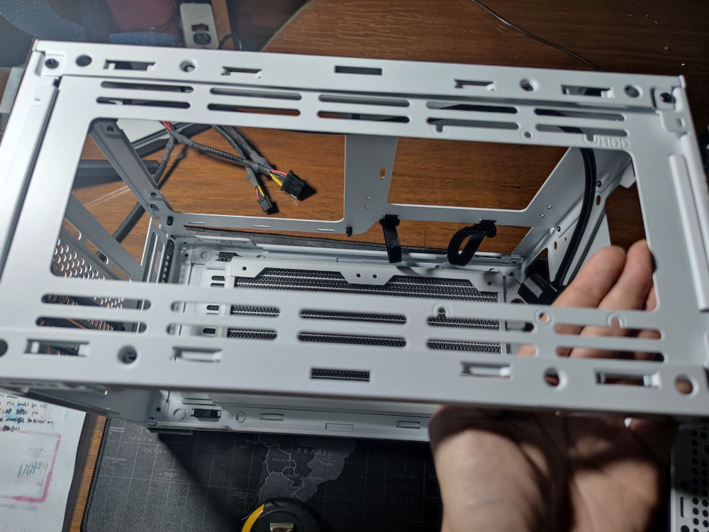 As seen in the picture, this position gave me a level mounting bracket for the top, with less difficulty for locating the holes for the screws.