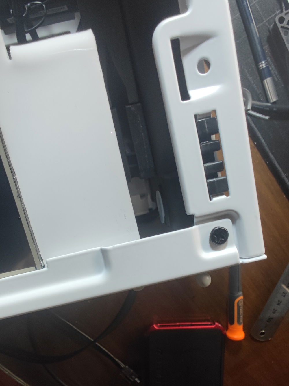 Test mounting the slim radiator revealed another potential problem - clearance for the tubing would be almost impossible. My first idea of routing to the side of the PSU cage, past the LCD screen, would not work, so I would have to go around the cage. A problem for another day.