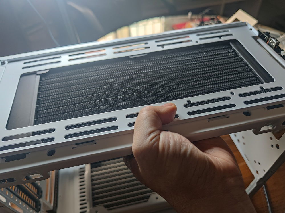 After my XSPC radiator arrived, a test fit proved it to be a good choice, at least width and length wise. Clearance to the RAM sticks remained to be seen.