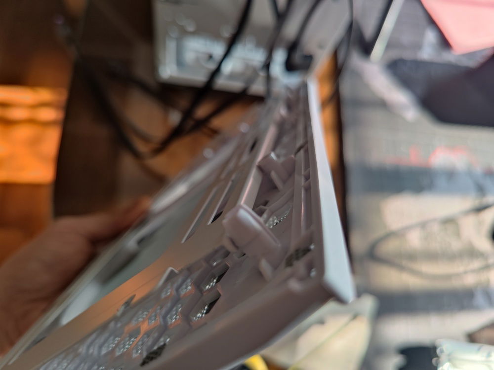 I had to grind off some of the mounting pins and also cut a channel where the raised metal of the bracket would fit.