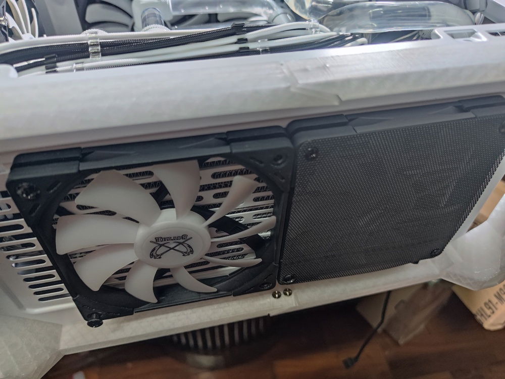 Fans secured onto the radiator inside and the case itself. Mesh filters also required.