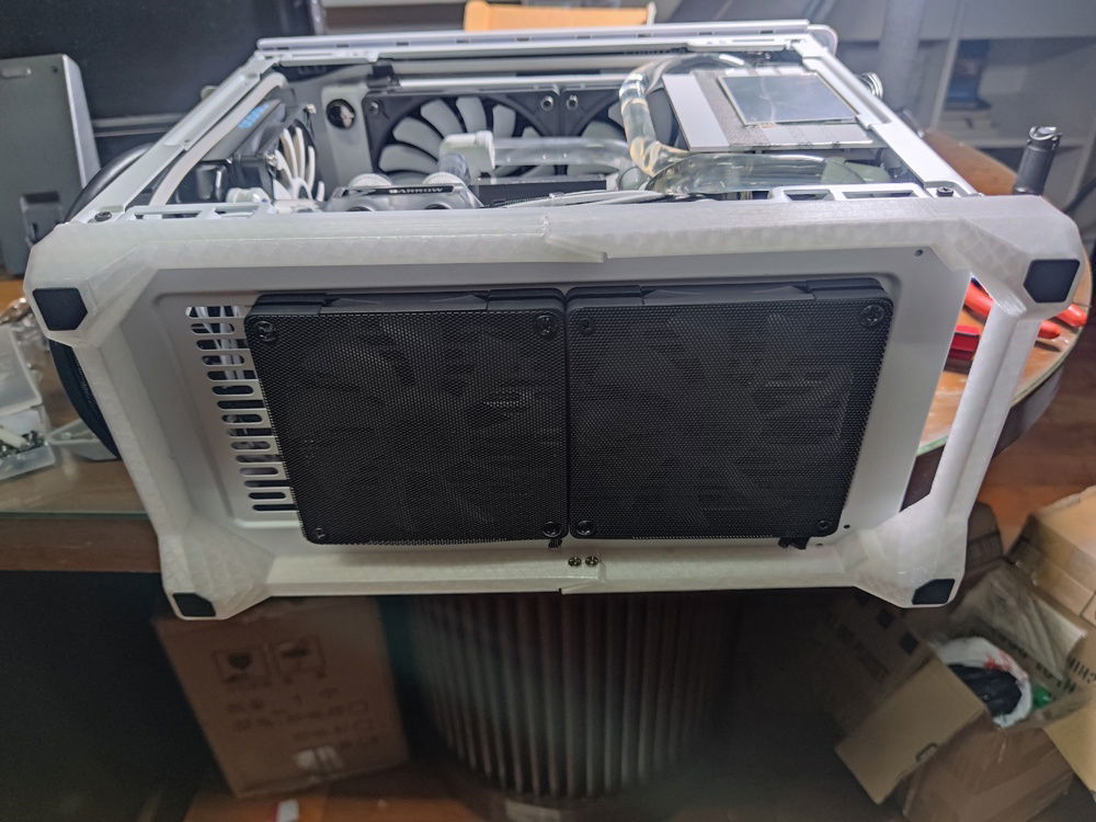 Finished. I intentionally chose RGB external fans to create a subtle underglow if I choose to turn on my RGB. The gap to the left of this picture is where the metal cover on the NR200 goes.