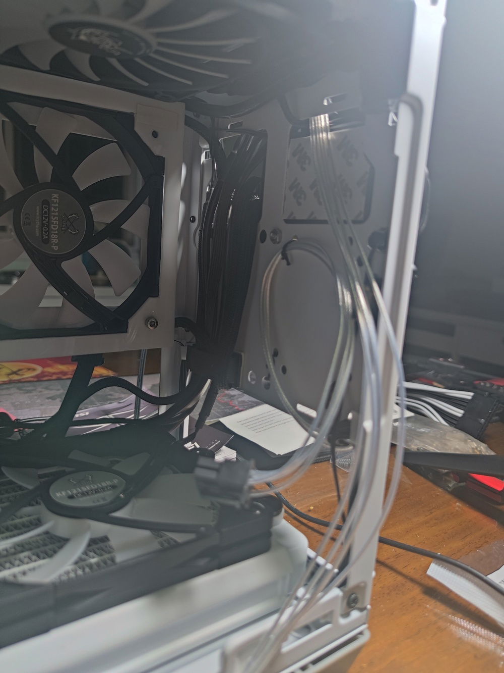 Most of the cables were hidden behind the PSU cage and out through to the front of the case and hidden behind the metal front decorative panel.