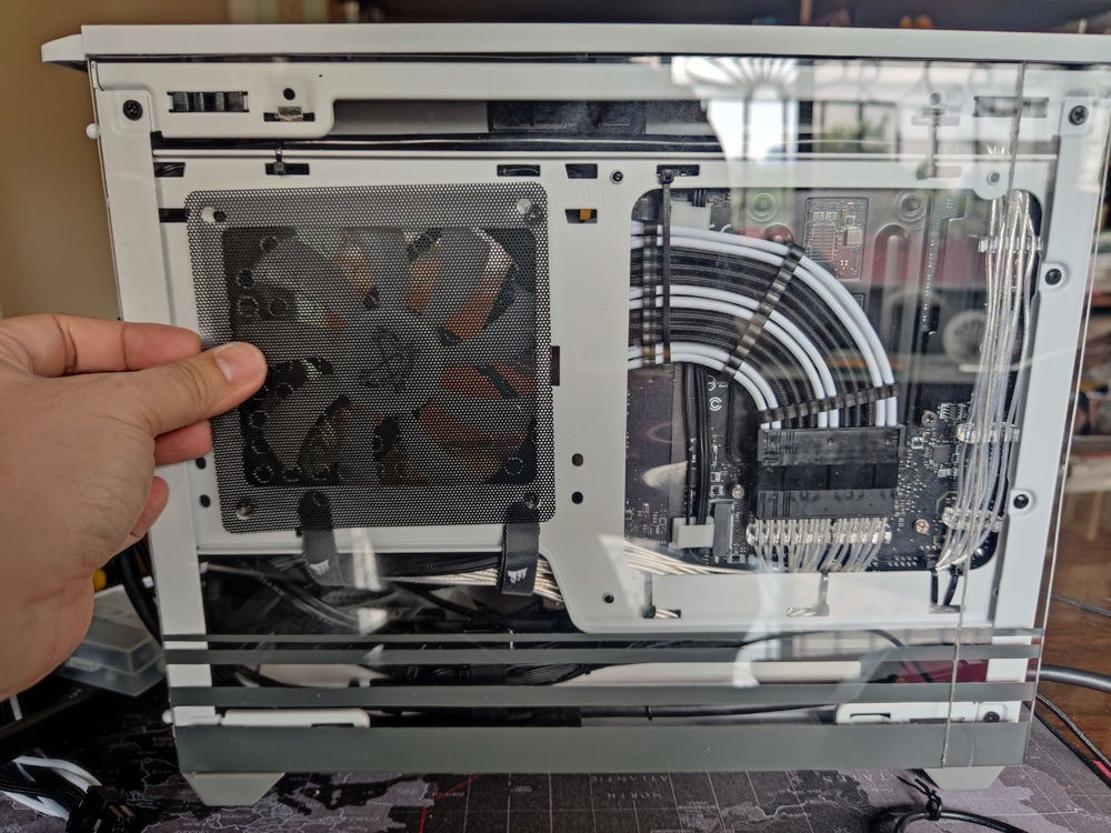 I used a spare plastic mesh to filter the intake. 

Note that the painted section was lined up with the black accents of the rear of the case. Gray and white was applied separately.