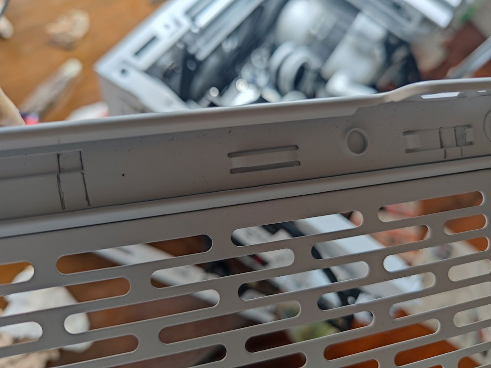 I wanted to find a way to minimize my cutting of the metal at the bottom to route cables for the external bottom push fans. 

I decided on cutting channels into the interlocking bottom post and panel. This minimized cable runs for a clean look even underneath the PC.