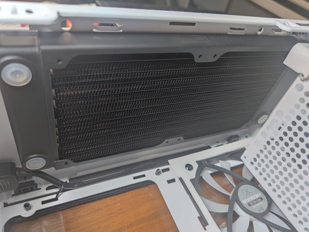 The top radiator choice was always the XSPC TX240, although I was tempted by the 17mm China-sourced radiator available on Alibaba or Taobao. 

I went with the tried and true and almost regretted it when the fan blades on my 12mm thick fans still caught on my RAM sticks.