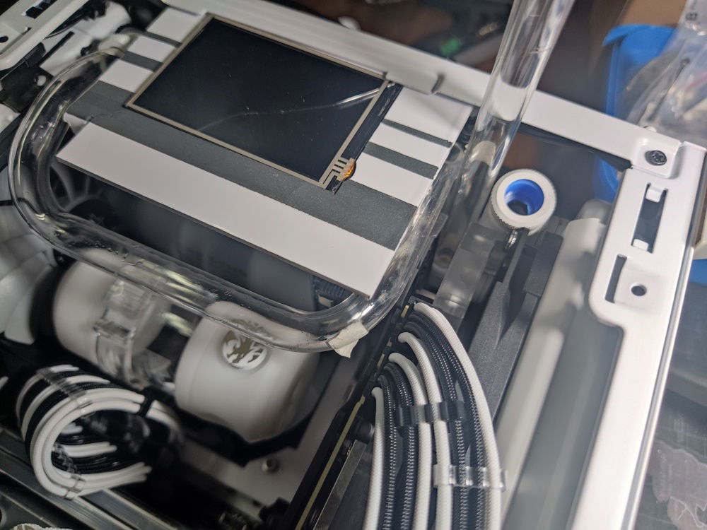 The top to bottom rad tube also had to clear the outlet tube  which would have to clear the VGA power cables and reach up to above the GPU to run towards the rear of the case.