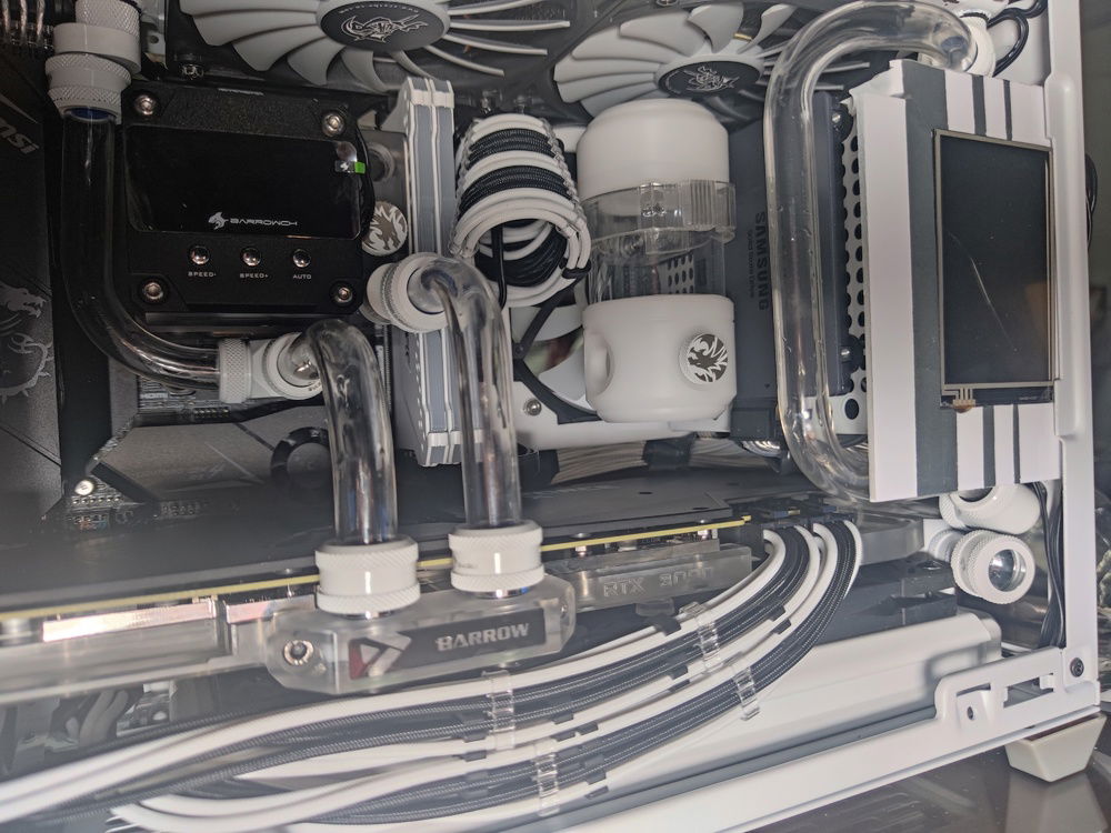 The route of the outlet tube towards the rear can be seen from this angle. I wanted to line up the tubes to minimize clutter and keep the tube runs (looking) simple. This set of tubes was also supposed to line up with the tube coming out of the reservoir.