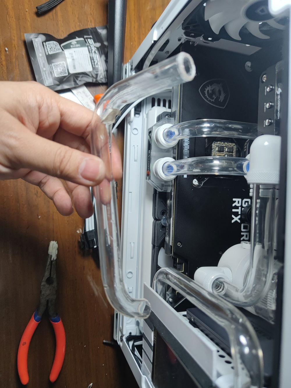 My first attempt at creating an even more complex bend from the bottom radiator to up over the VGA card.