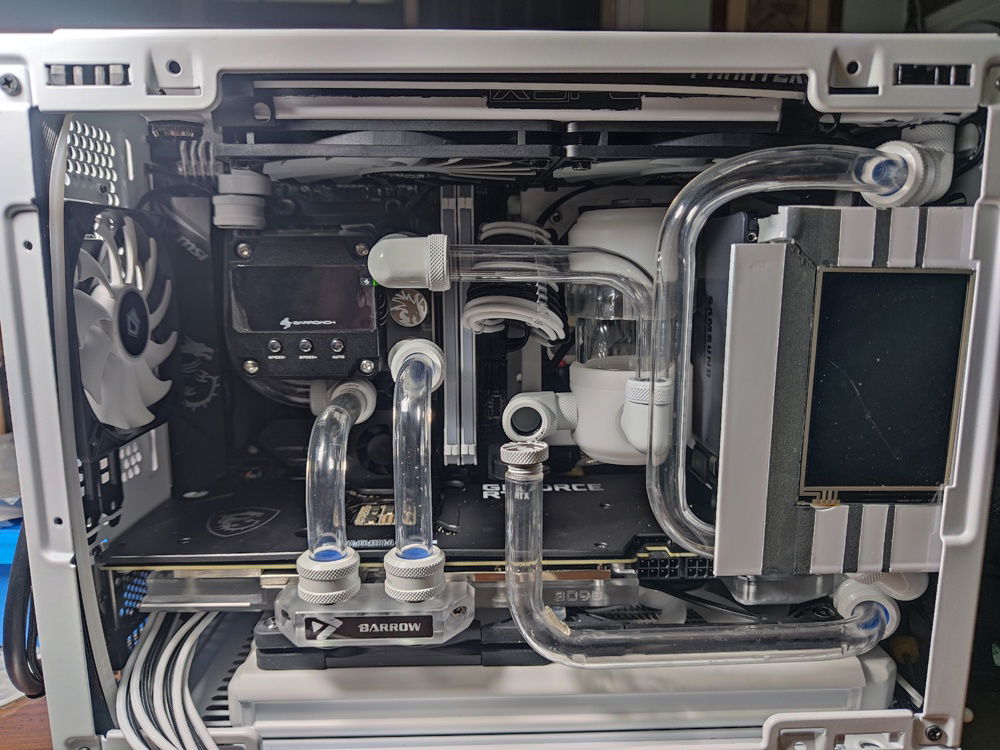 When my rear radiator was delayed in the mail, I was seriously considering just completing the loop without waiting for it. This is the turning point of my build where I was deciding whether to just connect the two tubes you see crossing each other and just rebuilding when that last part arrived.