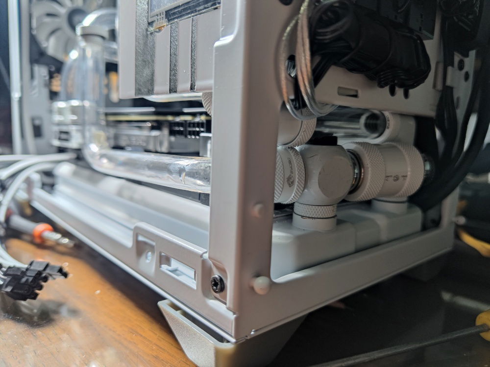 Another view of the bottom rad tube. I had to prevent it from touching the glass panel but I was constrained by the VGA power cables. 

This view also shows why a fitting here would not work; there was just not enough space for fittings.