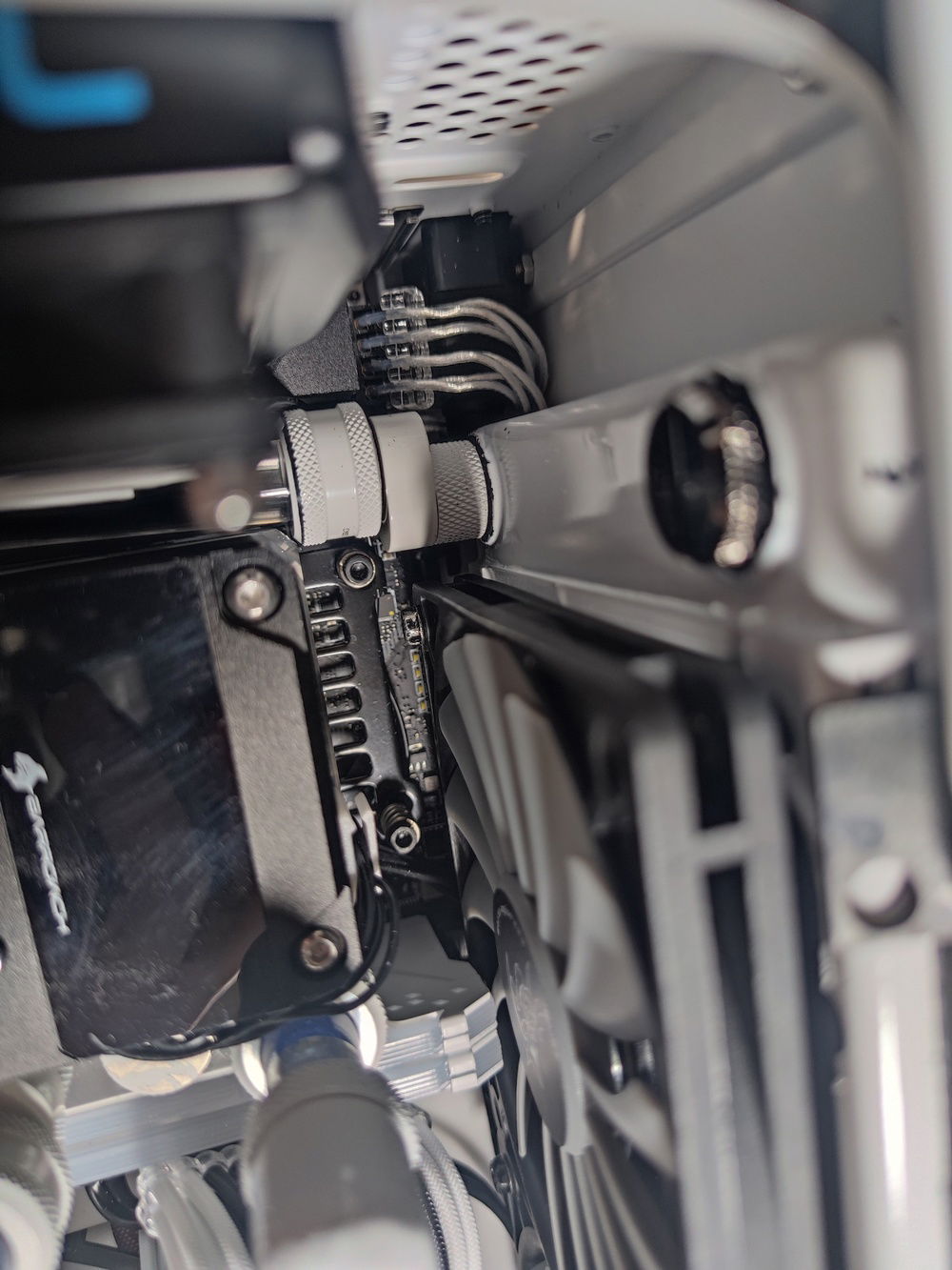 The offset fitting and tubing was skewed left until I reseated the CPU block/pump combo.

This was all the clearance I had to work with when I was turning the fittings and/or turning the screws.