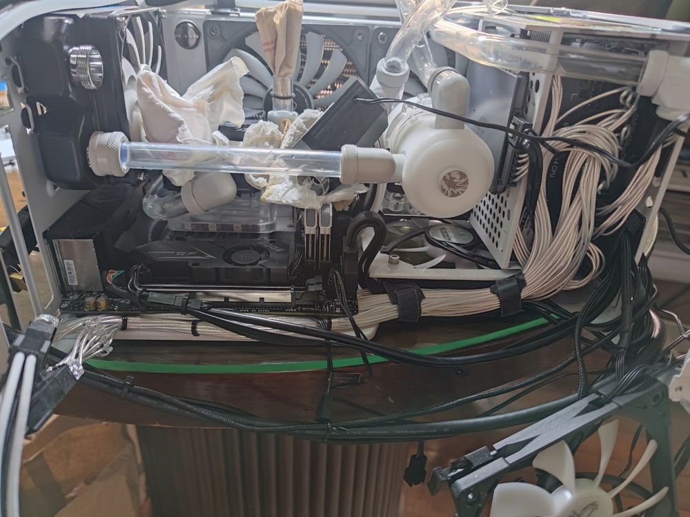 A view with the GPU removed. The PSU cables can be seen here hiding behind the motherboard and support structure of the case.