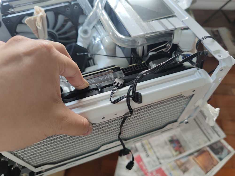 Just removing the bottom panel was nerve wracking since I had to hold up the radiator as I was removing the fan screws and water cooling tubes - without spilling any water onto components -  poor planning on my part before I jumped in.