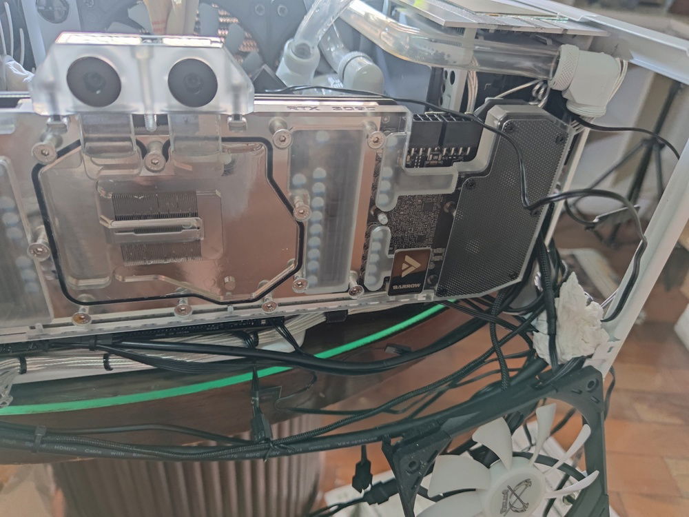 After removing the radiator, we see the GPU block and a mess of wires. I swear, it's arranged nicely now.