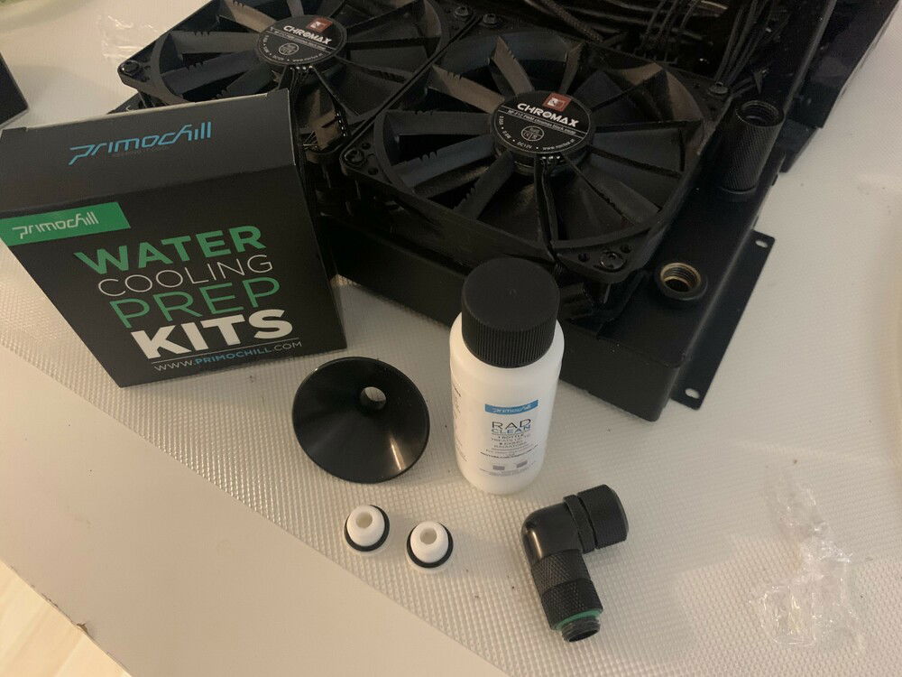 Kit for cleaning radiator. I really though the bottle and funnel were going to be bigger. it's really a tiny funnel. 

For such a small radiator I only needed 1/8th of the bottle and 250ml of water. Turned out a small water bottle was perfect for mixing the water and chemicals together. Also worked well with funnel to poor into radiator.