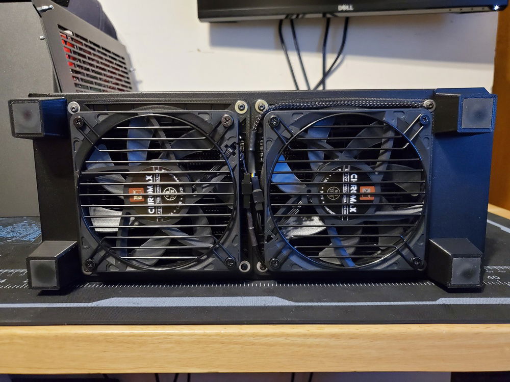 3D printed fan brackets and case feet, along with a little trickery with some PETG and 3M rubber cut to size for some padding and sliding protection.