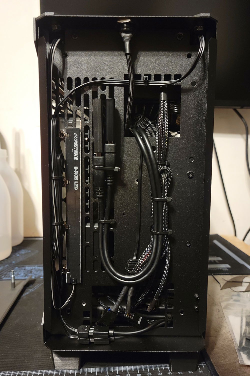 Front of the case behind the panel. This is where I've hidden pretty much all of my wiring, as well as my wireless dongles.