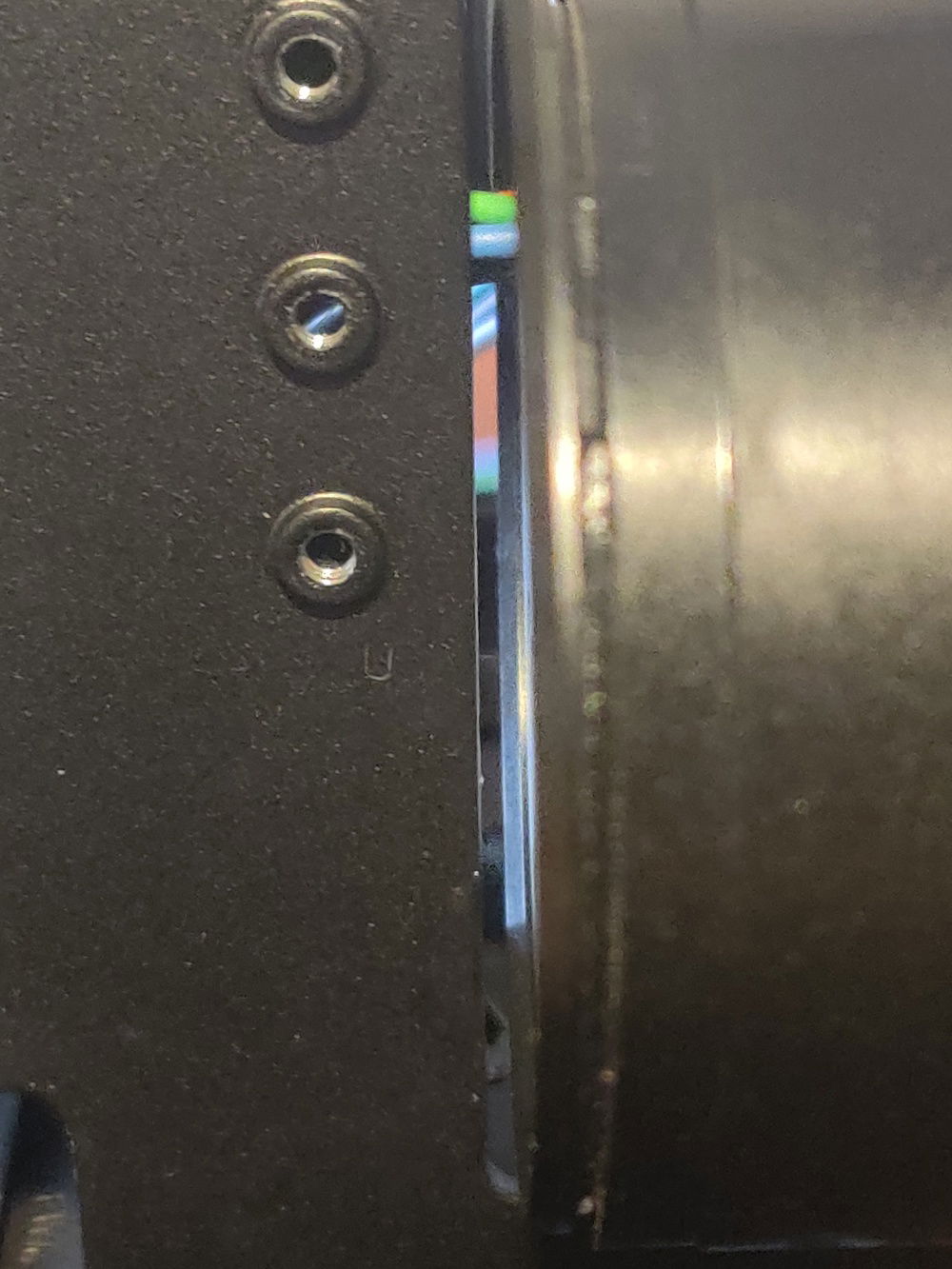 That's at most 2mm of space. Also the wires from the pump slide right behind the space between the PSU and the spine so it hides the yucky colored cables.