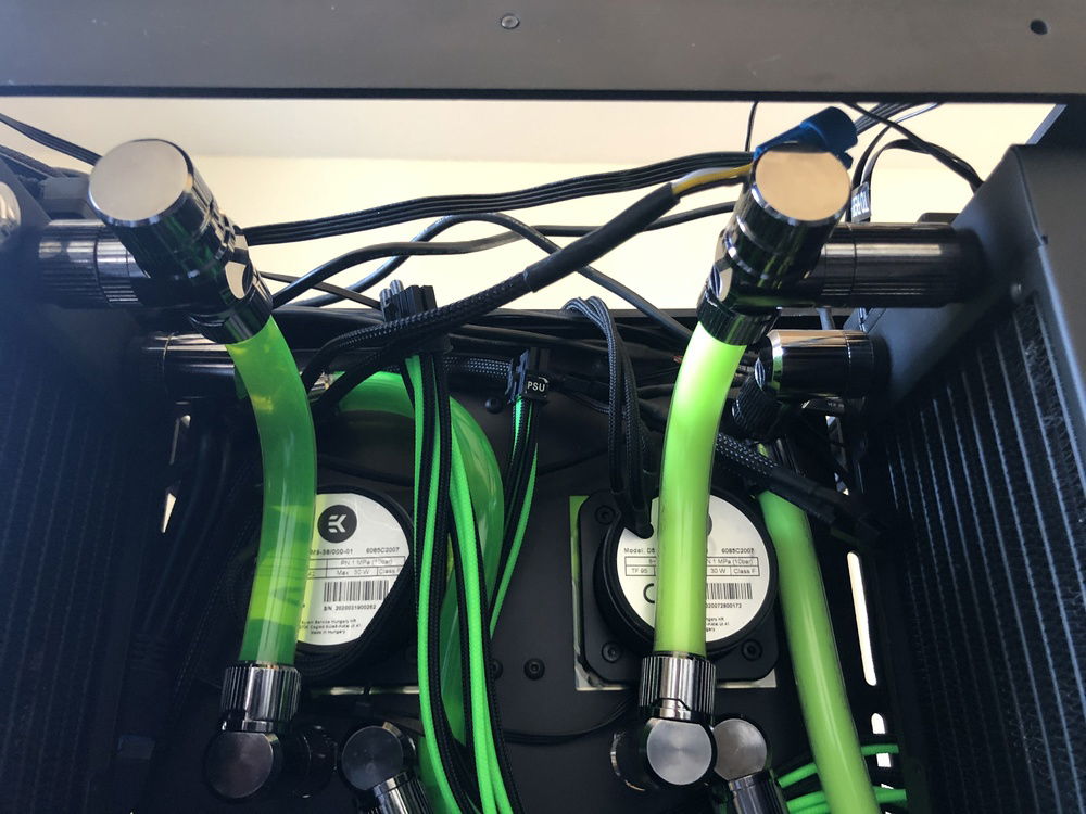 With EK Torque drain valve. Both locate at top but if put case on the side it’ll become bottom and clear to drain.