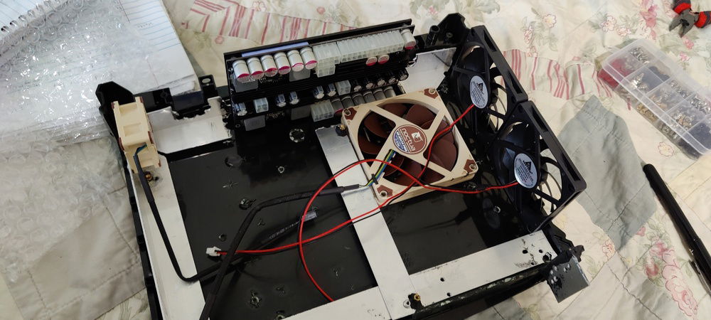 All fans being used as intakes. I figured the build was small enough that exhaust would just be forced out. Plus, I need constant cool air passing over the 500W PSU.