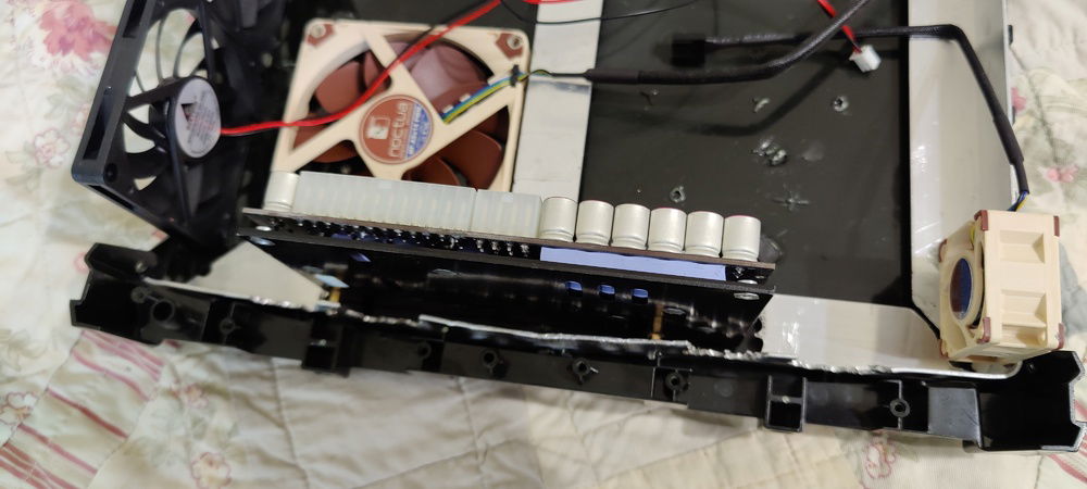 PSU attached to base bracket with just 2 screws and standoffs.