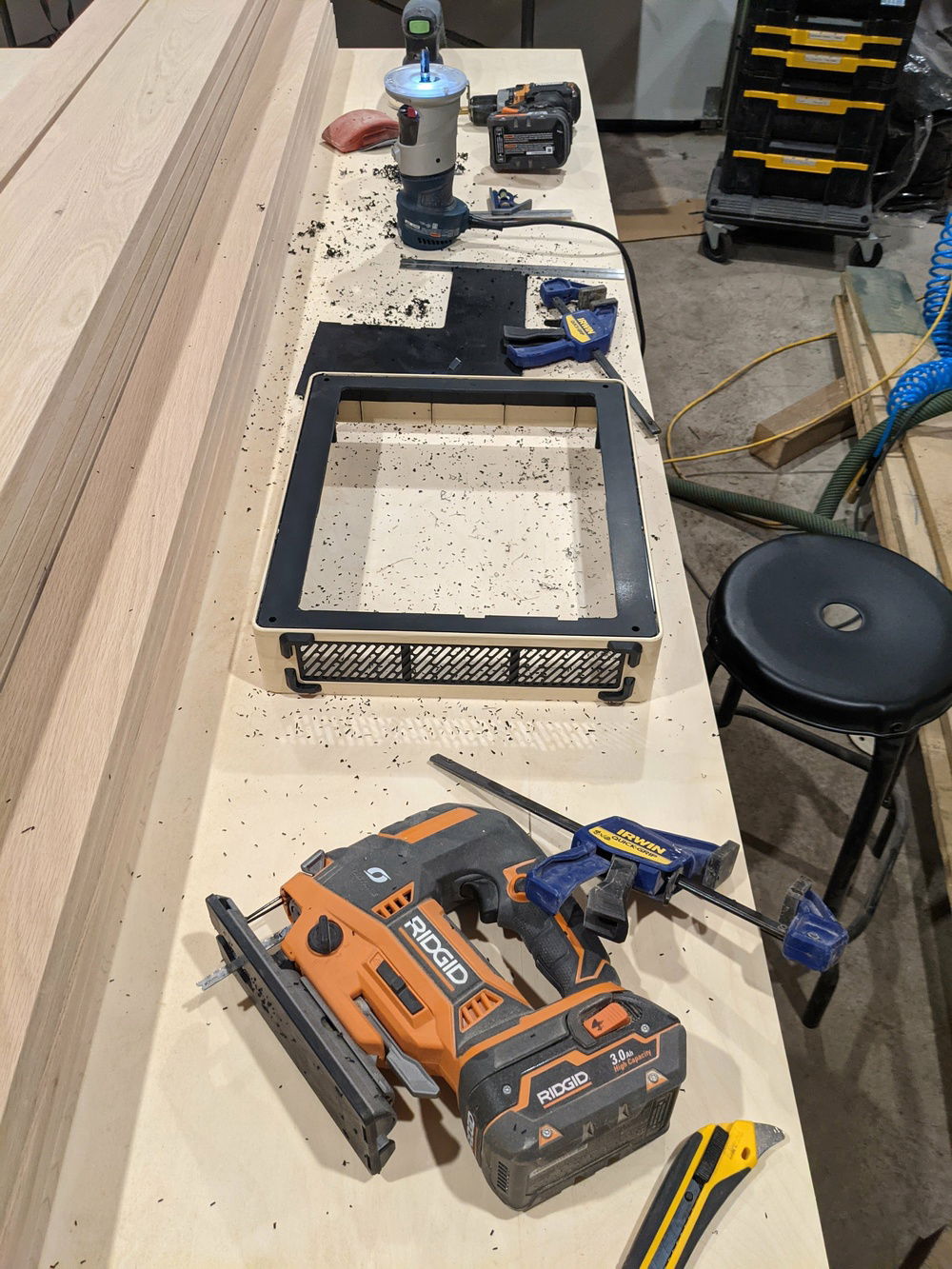 Drilled out the corners with a 1/2" bit then used a jigsaw to cut the majority of it out, and a router to clean up my edges.