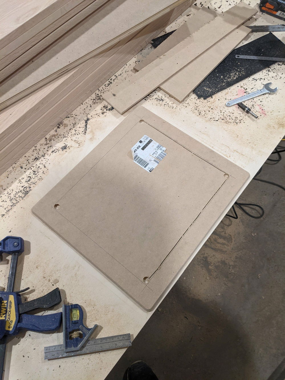 Frame for the speaker mesh. 1/4" MDF with the center cut out.