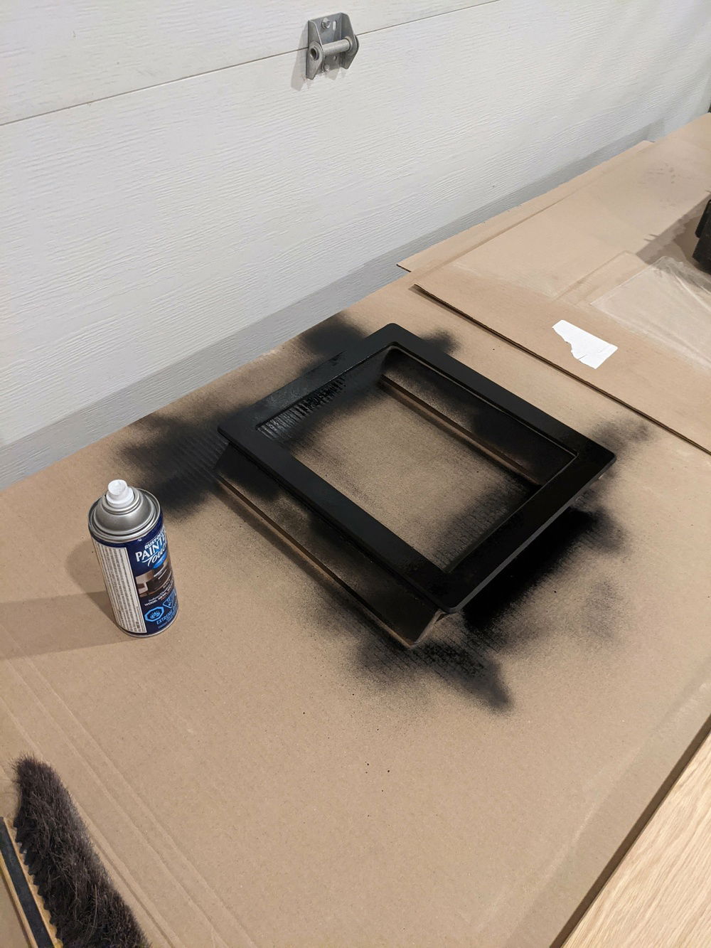 Sprayed it matte black to reduce the chance of it being visible behind the fabric