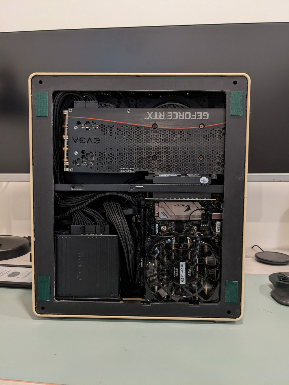 Used double-sided foam tape on the case side to pad out the inset where the original metal panel sat.