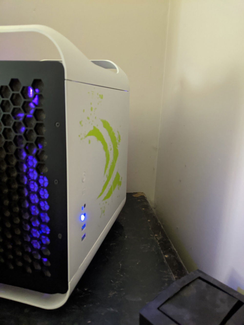 This Prodigy isn't just an Arctic White version, it's a special Nvidia edition. The stock left side panel has a GTX logo as well.