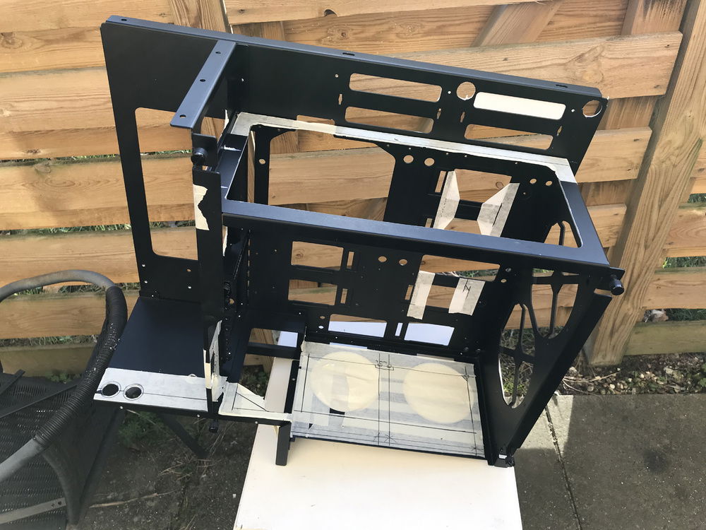 Cutting the case to get room for water-cooling and other goodies.