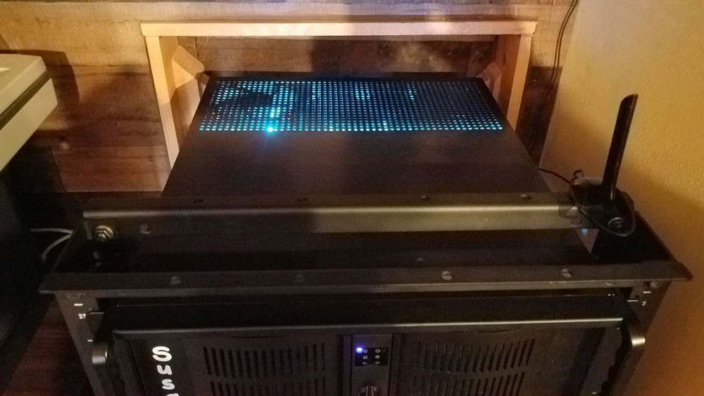 An exhaust fan is mounted above the PCIe slots and the left side and rear vents above the slots are blocked off to help the fan pull air from the front of the case. Unfortunately the vent holes do not mach a 120mm fan so three of them had to be ovaled towards the keystone screw.