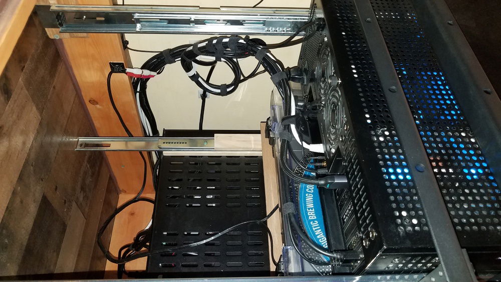 The wiring harness is supported to the back of the chassis with Zip Ties to avoid cables from getting unplugged and comments for a replacement would be appreciated. The loop is to avoid kinks pulling Susan out and is attached to itself with elastic to avoid rubbing into the turntable below. The lone cable going down the middle is Susan's power cord.