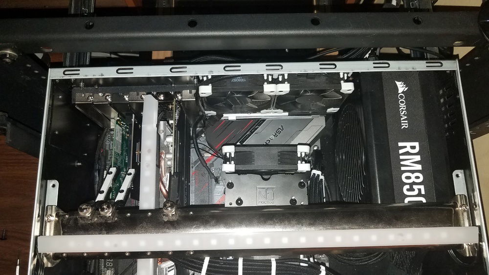 To help bring the black and white theme to the back of the case, white anti-vibration pads are used and some custom card retainers I made were painted white. I really do not like the red print on this motherboard.