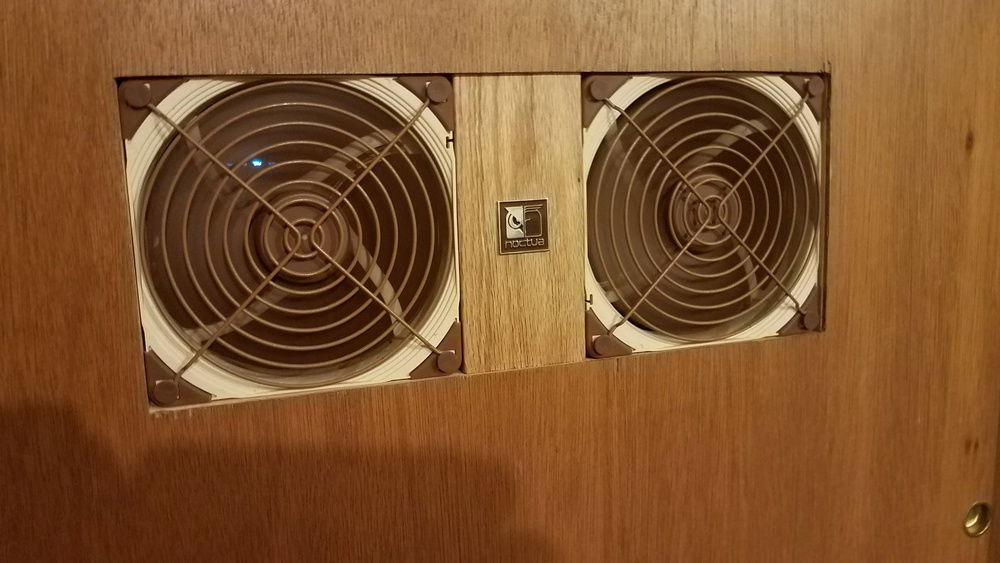 I had some brown paint from a past project for the fan grills. You lift the fan up 1/16 in. then slide the bottom out to remove for service or replace. 5/16 Drawer bumper pads stop the doors from becoming flush with the walls, allowing some warm air to escape. An exhaust fan to the adjacent room or outside is coming soon.