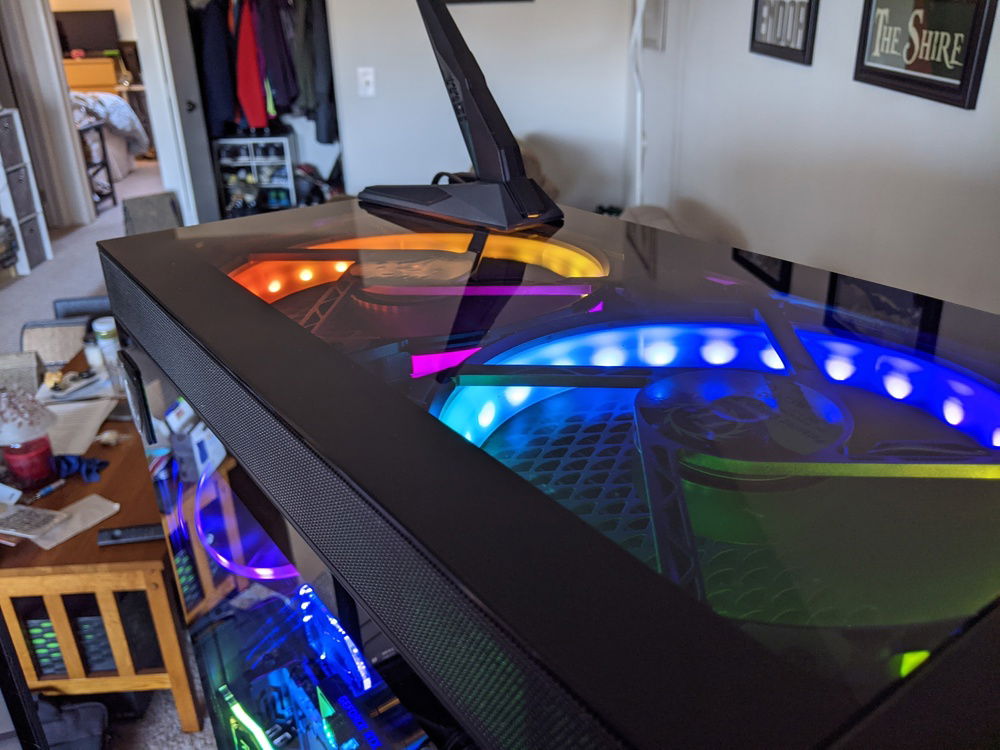 Thermaltake fans pulling hot air out of the case.  Not a ton of clearance for good airflow with this case though.