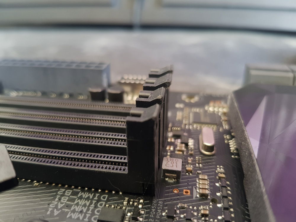 Had to file down the ram slot clips considerably as they contacted the GPU backplate