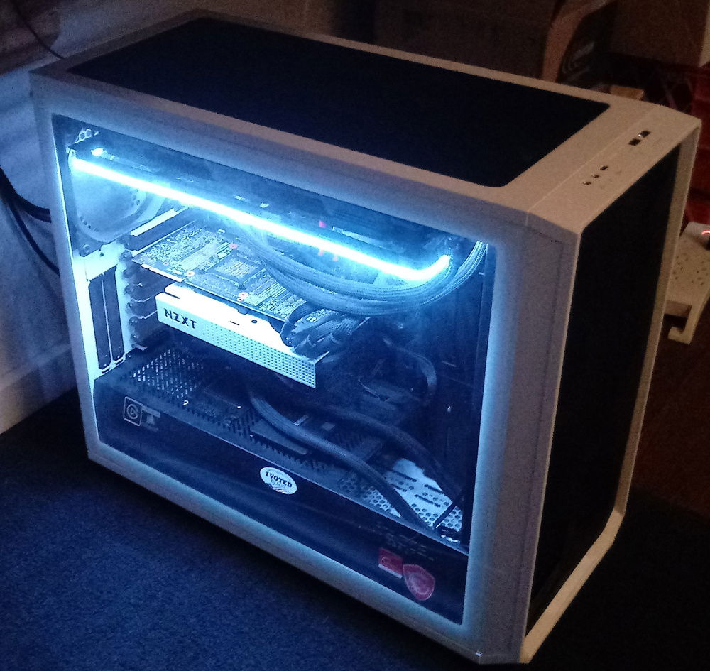 Old:
I blame my phone for this picture. The light is extremely subtle in real life compared to this bloom filled photo. Probably also didn't help the glass sidepanel was on, so maybe bad camera quality + glass reflecting light?